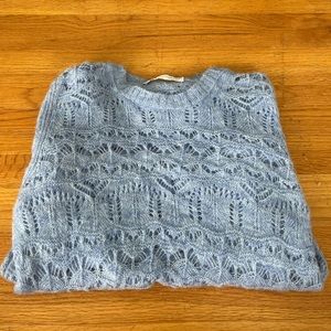 crocheted blue sweater
